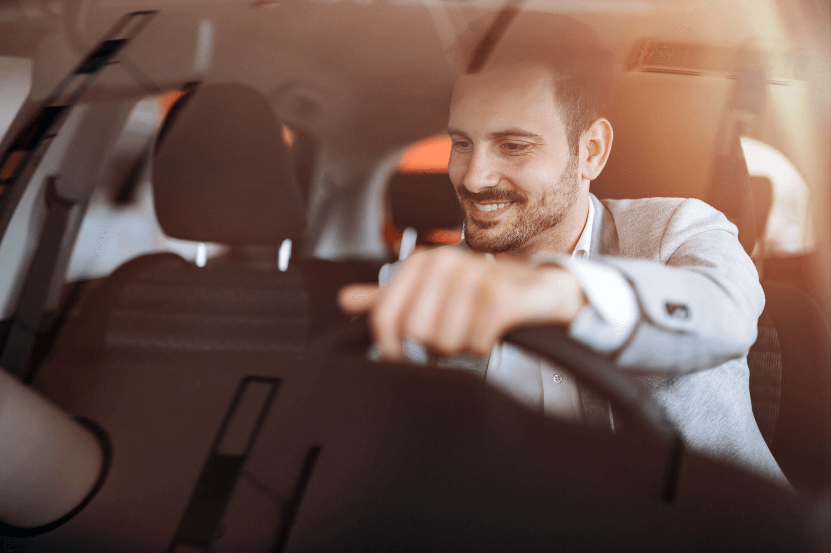 happy driver riding in a car